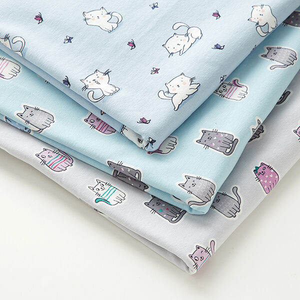 Baumwolljersey freche Katzen  – babyblau | Reststück 50cm